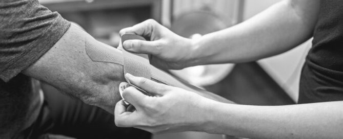 Elbow kinesiology tape therapy treatment