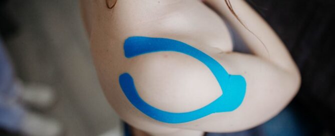 Shoulder with kinesiology tape for pain support