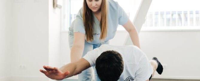 Physiotherapist assisting patient in treatment